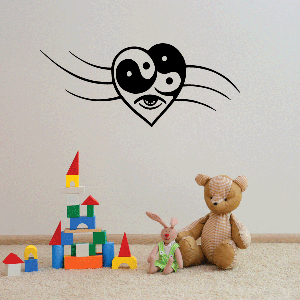 Yin-yang heart wall decal with black eye faces and swirl accents