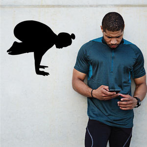 Yoga wall decal with black silhouette in standing forward-bend pose