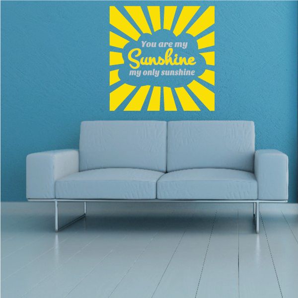 Sunshine quote wall decal with yellow sunburst and white script lettering