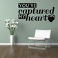 Black wall decal text: "You've captured my heart" with small heart icon