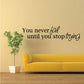 Wall decal with text “You never fail until you stop trying” in mixed cursive