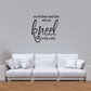 Motivational wall decal with 'kneel to help a child' in black script lettering