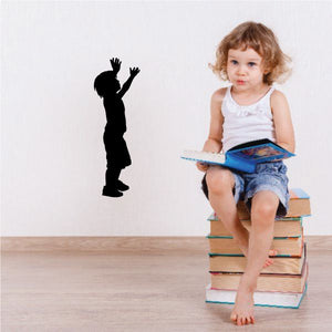 Young boy silhouette decal with arms raised