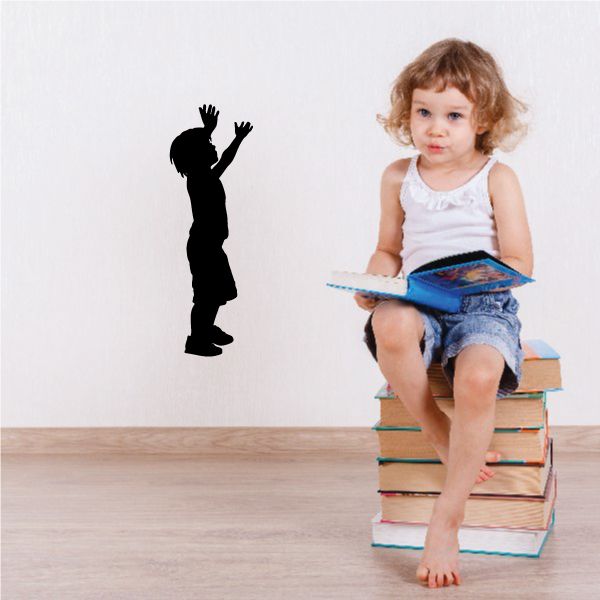 Young boy silhouette decal with arms raised