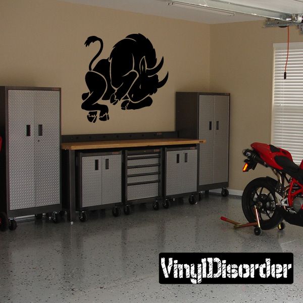 Black sleeping bull decal wall art with curled horns and wings