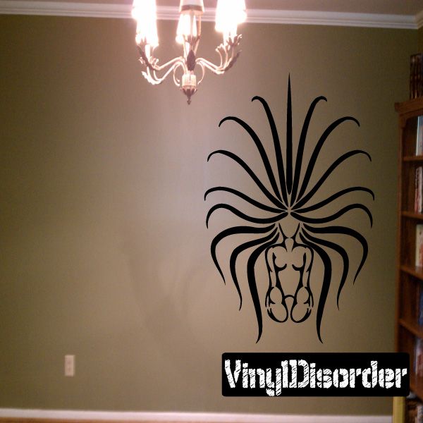 Virgo kneeling figure wall decal with black ornate stylized design and raised hands