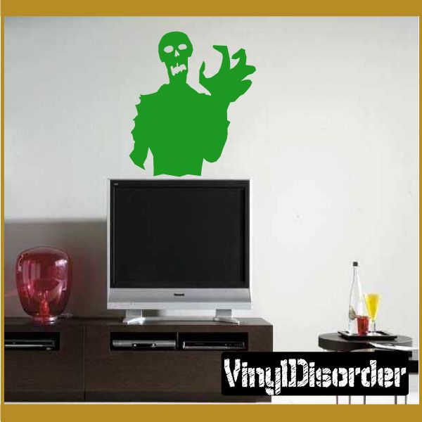 Green zombie clutch decal with raised hand and skull face on light background