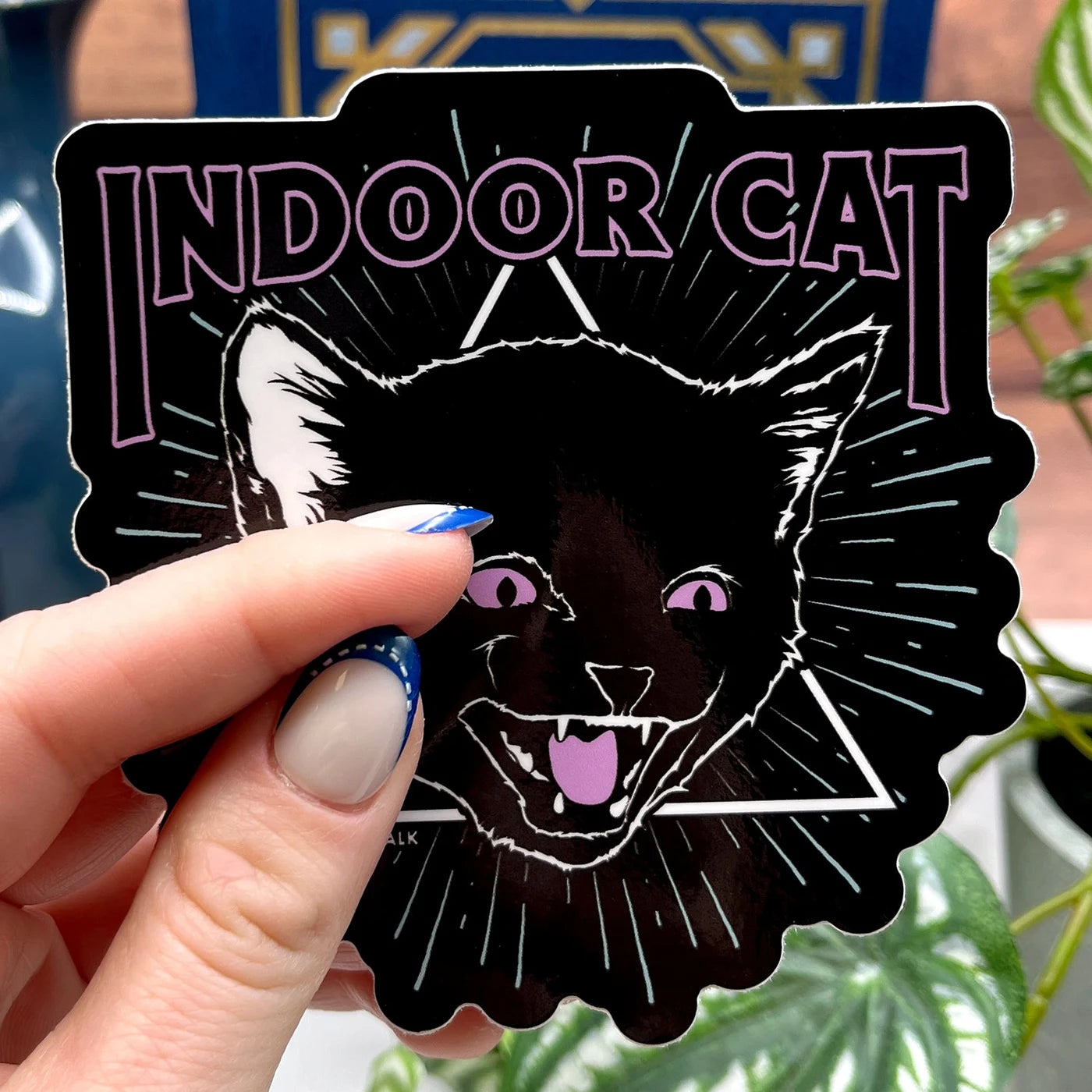 Boredwalk's Indoor Cat Introvert Die Cut Sticker photographed as a finished sticker