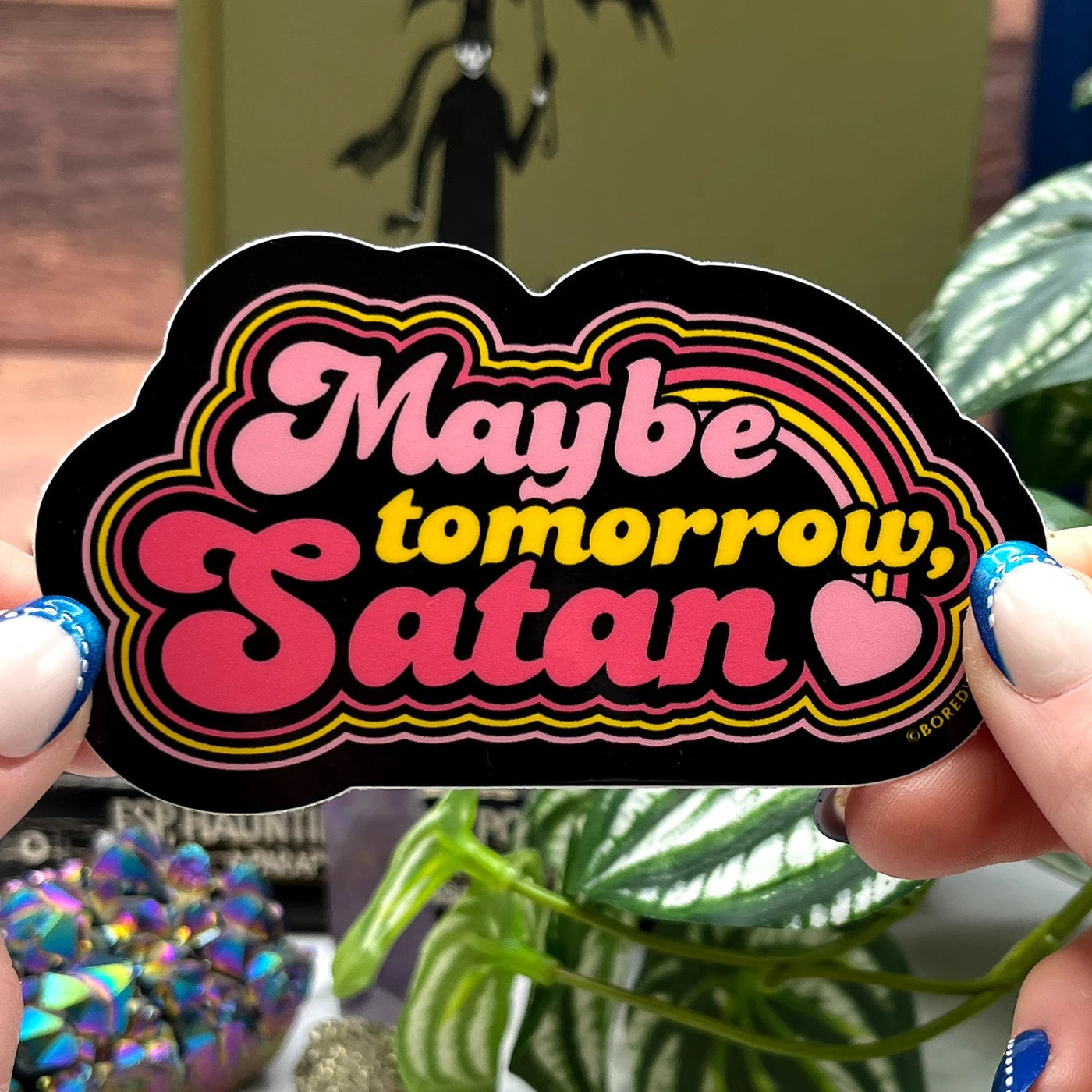 Boredwalk's Maybe Tomorrow Satan Die Cut Sticker photographed as a finished sticker