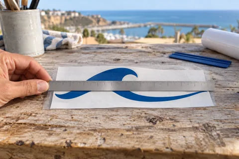 Illustrative coastal example of measuring the longest side of cut vinyl, not its backing liner