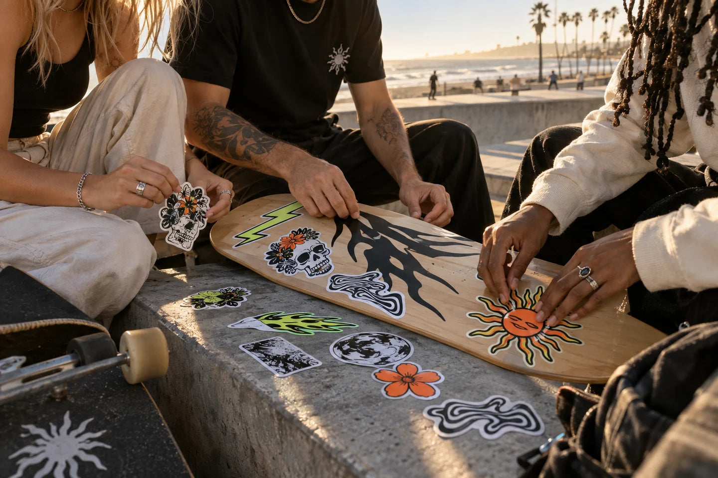 Friends decorating a skateboard by the coast — illustrative creative scene