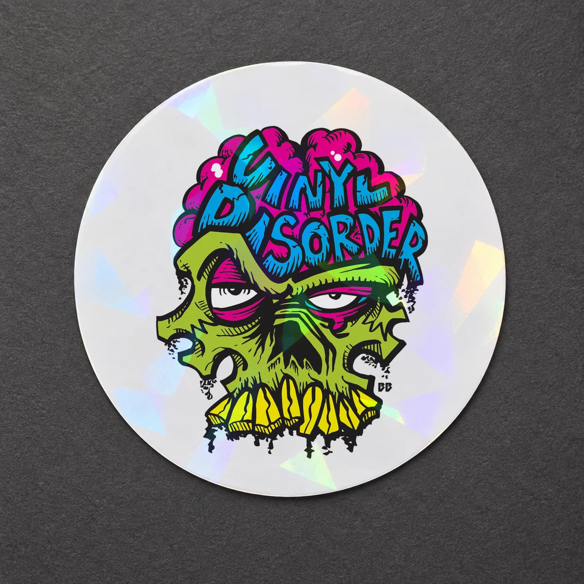 Reference-based render of the authentic Vinyl Disorder skull printed on Cracked Ice Holo.