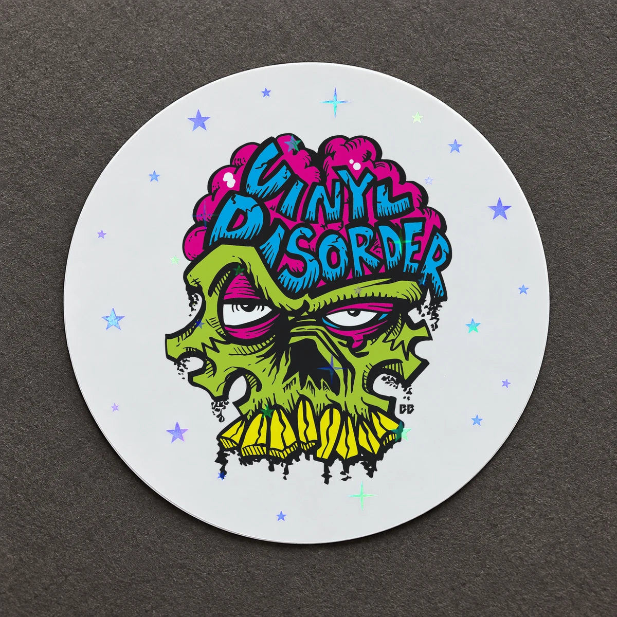 Reference-based render of the authentic Vinyl Disorder skull printed on Galaxy of Stars Holo.