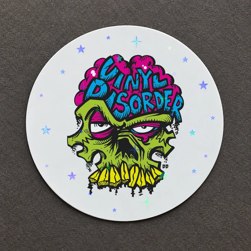Vinyl Disorder skull with a holographic star laminate.