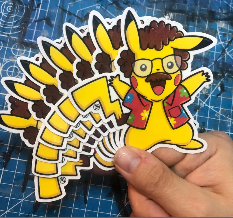 Hand holding a stack of Rodger Beck Polkachu stickers