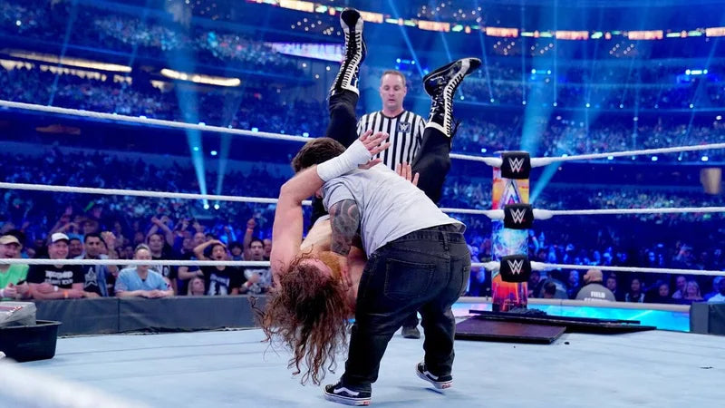 Wee Man lifting Sami Zayn during WrestleMania 38